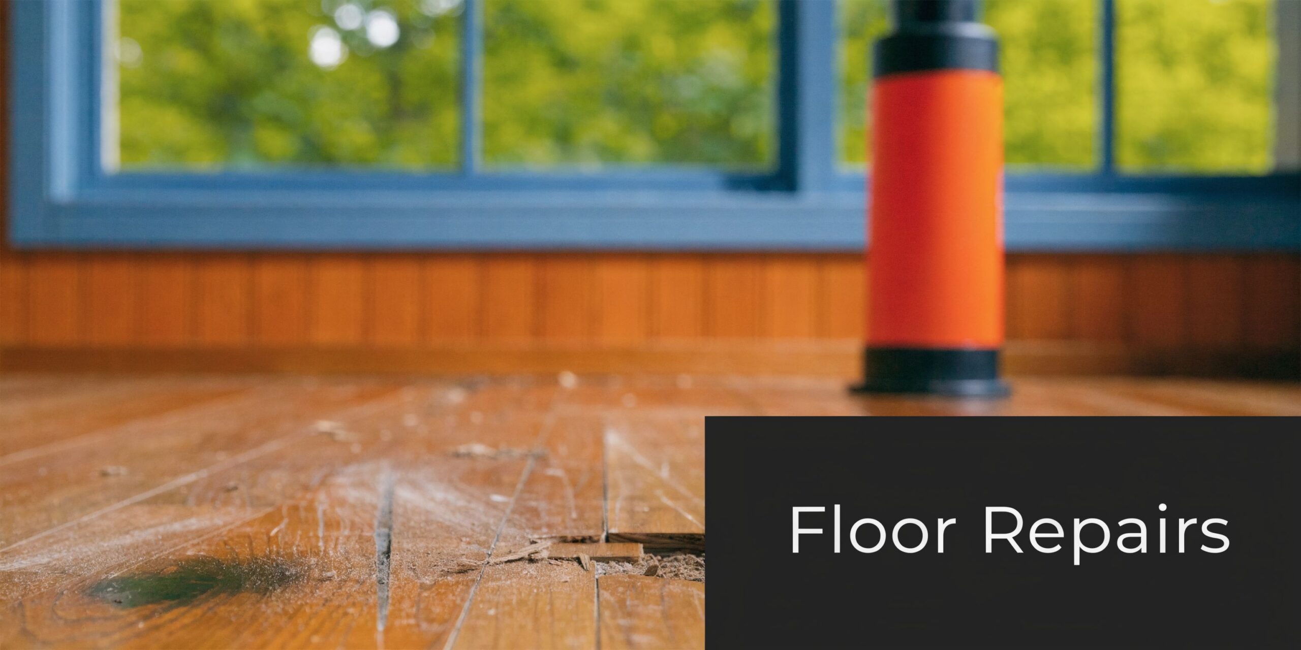 Close up of a damaged hardwood floor in need of professional repair and refinishing services.