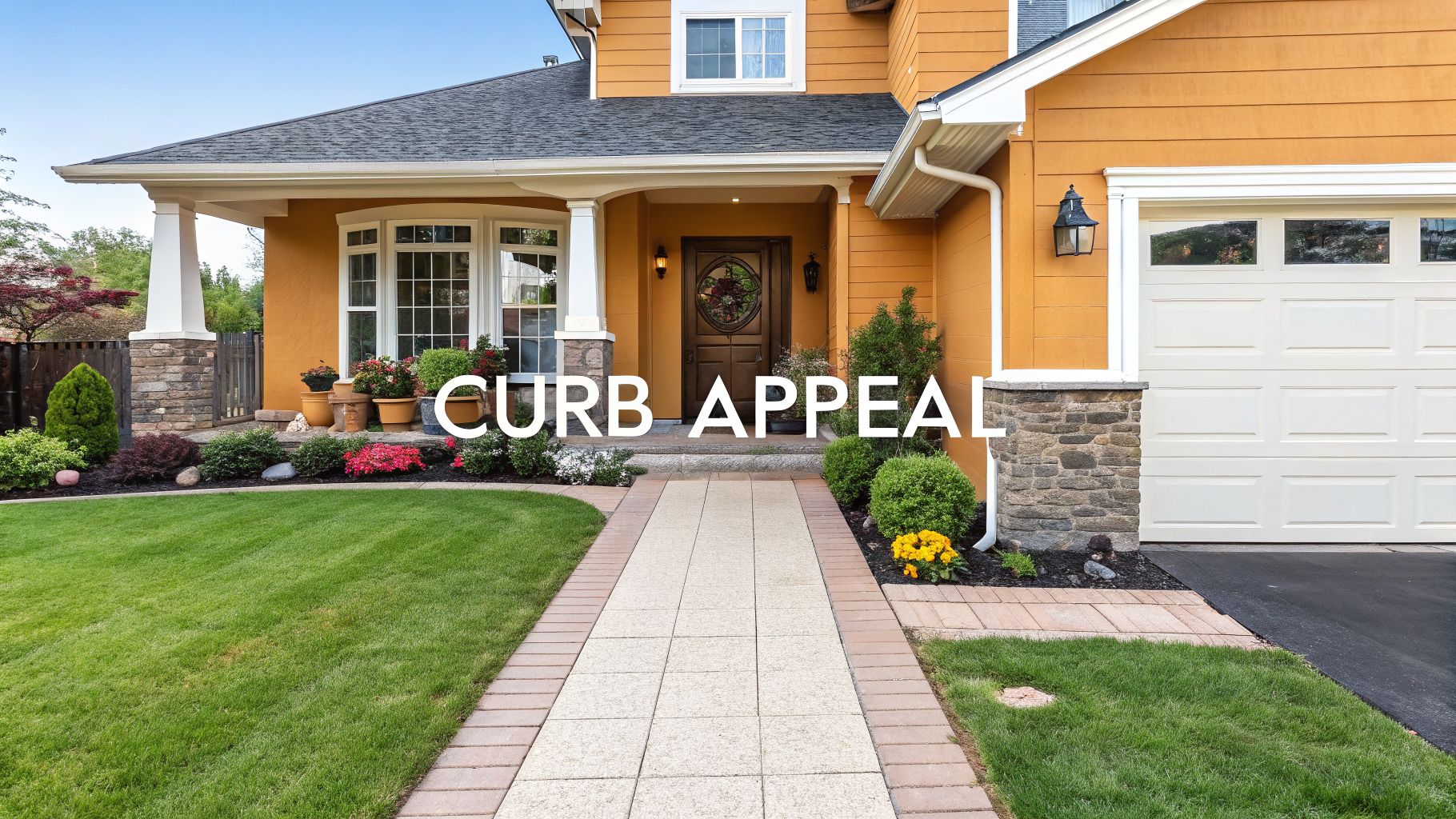 Front exterior view of a charming yellow house with lush landscaping and a welcoming walkway.