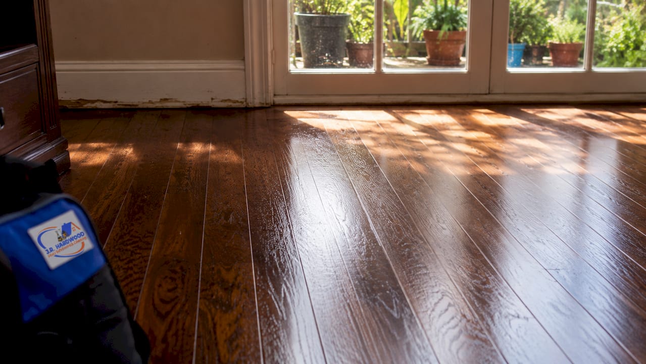 Brightly lit refinished hardwood floor close-up